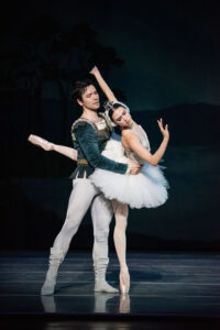 Two ballet dancers on stage in black and white