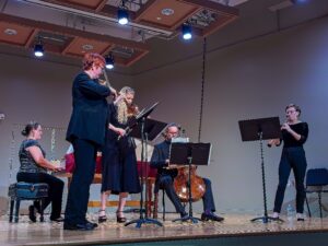 Five chamber musicians performing onstage